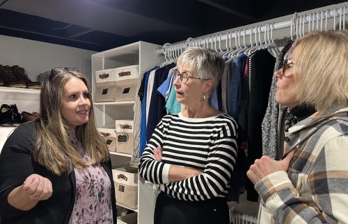 GREG VANDERMEULEN THE CARILLON 

Agape House executive director Tracy Whitby chats with Chrysalis Fund members Karen Toews and Debbie Krahn in the new community closet.