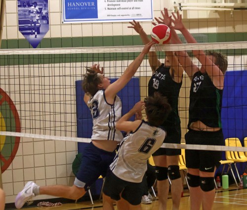 Green Valley players block an attempted hit from Landmark during the Zone 13 AA championship. (Cassidy Dankochik The Carillon)