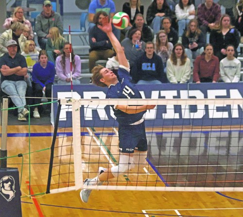 Lowe Farm's Cole Doell goes for a kill during Providence's straight-sets victory over Assiniboine College Nov. 21. (Cassidy Dankochik The Carillon)