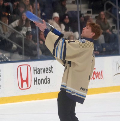 Chris Quizi chipped in to help Pistons game-day production by manning the team's T-Shirt cannon. The goaltender has been injured this season, but was named the team's RBC Community Ambassador. (Cassidy Dankochik The Carillon)