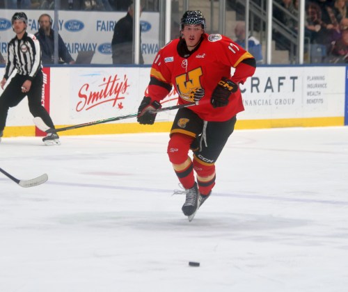 St Jean's Sebastien Hicks chases down a puck during a Waywayseecappo Wolverines game in Steinbach earlier this year. (Cassidy Dankochik The Carillon)