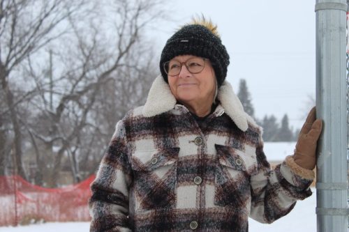 MATTHEW FRANK THE CARILLON 

Leona Doerksen, chairperson for The INN, stands at the proposed assisted living transitional housing site on Main Street in Steinbach on Dec. 9. She views Main Street Project’s endorsement of the plan as an important step in developing the Steinbach facility.