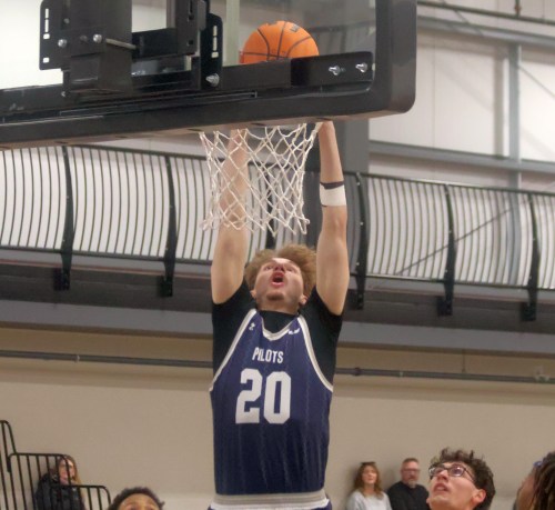 Parker Antonovos dunks the basketball during a Providence Pilots win Jan. 24. (Cassidy Dankochik The Carillon)