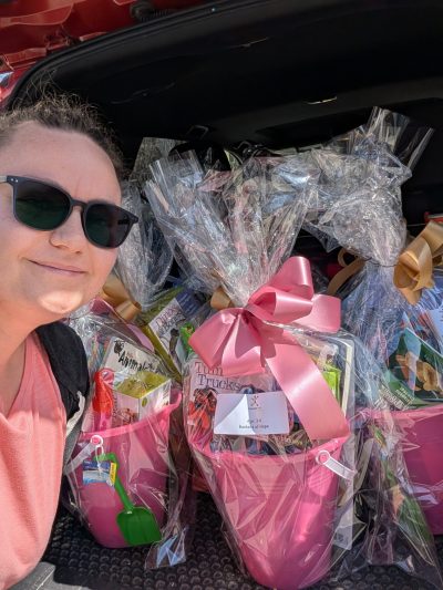 SUPPLIED 

Tia Sunley, a Discovery Toys advisor from Lorette is pictured with baskets during the 2025 campaign. This year they will assemble 350 baskets.