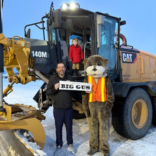 SUPPLIED 

River Calais poses with his father and Ritchot’s mascot with his winning name Big Gus for the Name A Plow contest.