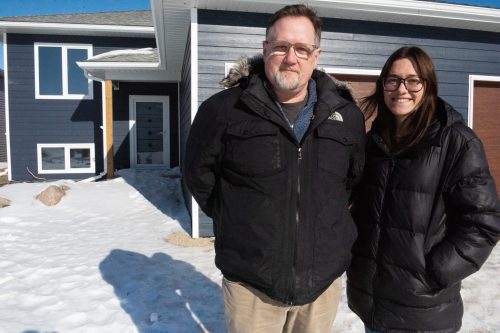SVJETLANA MLINAREVIC THE CARILLON 

Initiatives for Just Communities director of services and operations Kevin Drain (left) stands next to associate director Bella Harder in front of the transitional housing unit located in Mitchell, on Feb. 11. The duplex is located at 64 and 66 Birchwood Lane and will house six female residents with intellectual disabilities who are high functioning. There will also be two on-site around the clock support staff. The housing program will help the women learn essential life skills, such as budgeting, grocery shopping, housework, working through relationship issues, and getting employment. Residents are expected to move in this spring.