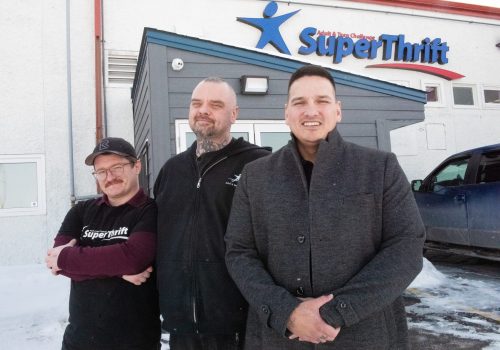 SVJETLANA MLINAREVIC THE CARILLON 

Adult and Teen Challenge Steinbach community support worker Richard Halverson stands outside of the organization’s new Super Thrift Store located at 16 Pioneer Drive with ATC’s students Nicholas Hiebert (left, who has been in ATC programming for three months) and Justin Klassen (who has re-entered programming for the third time) on Feb. 20. Halverson said the organization’s new location will have 20,000 sq.ft. of retail, a warehouse, vocational training, and automotive shop space. The new location was purchased for about $1.8 million by ATC, which held its grand opening on Feb. 21.