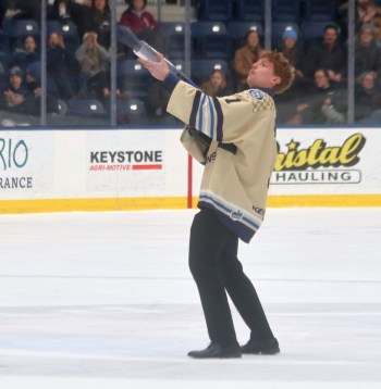 Chris Quizi uses the Pistons t-shirt cannon to launch merchandise into the crowd during a Steinbach Pistons game. (Cassidy Dankochik The Carillon)