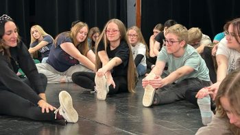 GREG VANDERMEULEN THE CARILLON 

Left, founder and director of Artista Academy, Gabriela Gallo, leads the cast in stretches as they prepare to rehearse.