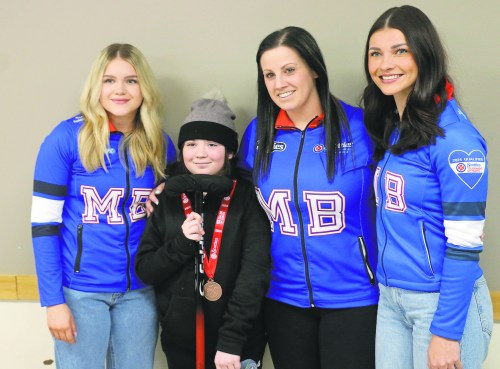 Team Kate Cameron poses with Kleefeld's Avery Heckert during New Bothwell's celebration of Cameron's bronze medal performance at the 2024 Scotties. Team Cameron directly qualified for the Canadian Olympic Curling trials based on their strong results over the past two years. (Cassidy Dankochik The Carillon)