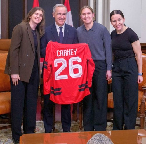Jocelyne Larocque (rightmost) presented Prime Minister Mark Carney with a Team Canada before heading off to the Olympics. (Prime Minister of Canada Twitter)