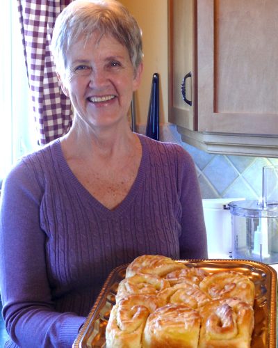 CARILLON ARCHIVES 

Betty Reimer shows off her pineapple rolls, a recent baking experiment. Ten of Reimer’s recipes will be part of the cookbook, Mennonite Girls Can Cook, which is expected to be released in May.