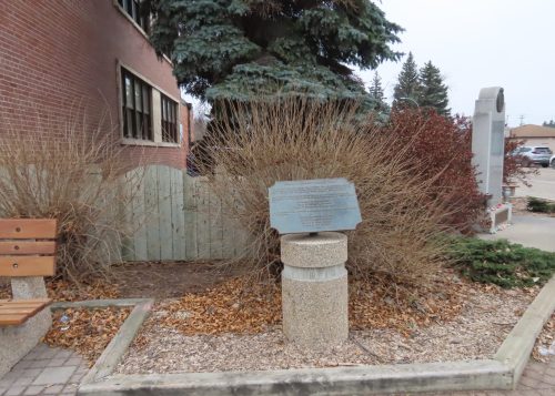 WES KEATING THE CARILLON

Nestled in a corner between the Steinbach post office and the community cenotaph is a pocket park dedicated to the memory of Frank F. Reimer.