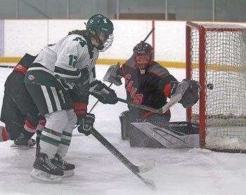 Vincent Massey's Ella Arnal slips a backhand into Gabrielle-Roy/Pointe des Chenes net during Manitoba Women's High School Hockey League playoff action in Ste Anne March 5. (Cassidy Dankochik The Carillon)