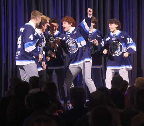 Max Powers-Brekke leads the Steinbach Pistons rookies in a performance of Uptown Funk by Bruno Mars for the team's annual rookie song at the Fire and Ice Banquet March 4. (Cassidy Dankochik The Carillon)