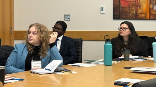 SUPPLIED 

(From left) University of Manitoba law students Ladina Thiessen and Grayson Cranney listen to Steinbach lawyers discuss their rural legal services. The Prairie Business Law Collaboration Just Grow Here program brought 11 students to Steinbach on Feb. 27, the first of its kind in Canada. The program aims to increase exposure and information for rural legal practices.