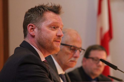 GREG VANDERMEULEN THE CARILLON 

Coun. Damian Penner makes the motion to approve the budget as Coun. Jake Hiebert and Coun. Michael Zwaagstra look on.
