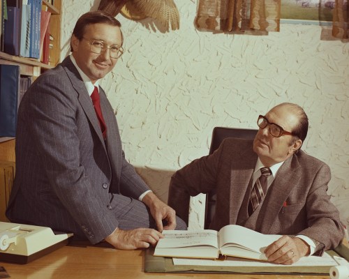 CARILLON ARCHIVES 

Eugene and Rick Derksen shared their dream of producing the best regional weekly newspaper in Canada, at Derksen Printers. Rick shifted roles from employee to part owner in 1967 and bought up the remaining shares over the years to become sole owner. That did not break up the father-son team, as Eugene continued to occupy his corner office at 377 Main Street and contribute a weekly column to The Carillon until his death in 1994.