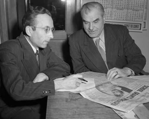 CARILLON ARCHIVES 

Gerhard S. Derksen and Bill Kornelson look over an article about school grants that will be translated into German for the next issue of the Steinbach Post.