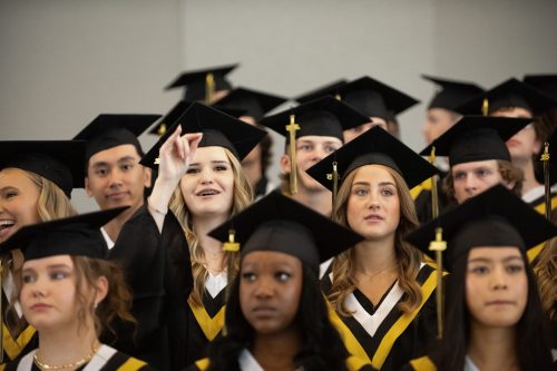 SVJETLANA MLINAREVIC THE CARILLON 

A Steinbach Regional Secondary School graduate waves to her family before the graduation ceremony at the Winnipeg Convention Centre on June 24, 2025.