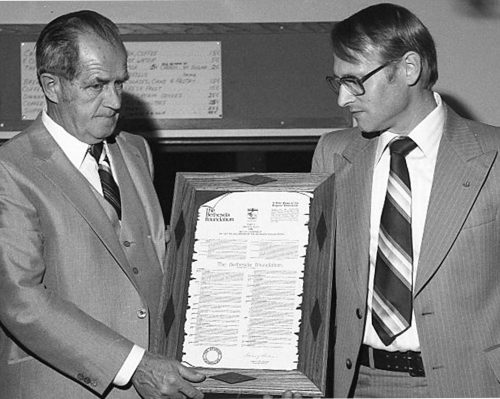 CARILLON ARCHIVES 

P.J. Reimer, founding chairman of Bethesda Hospital Foundation, receives a copy of the new fundraising organization’s charter from Bethesda Hospital chairman Henry Dueck.