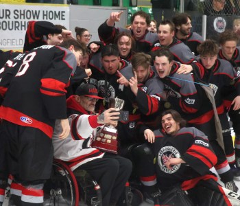 Dale Plett takes a selfie with the CRJHL championship trophy and some of the players on the La Broquerie Habs, after the team beat Selkirk 3-0 in game five of the finals to clinch a series victory. (Cassidy Dankochik The Carillon)