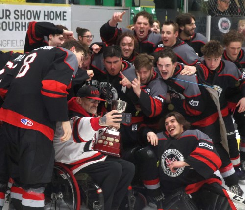 Dale Plett takes a selfie with the CRJHL championship trophy and some of the players on the La Broquerie Habs, after the team beat Selkirk 3-0 in game five of the finals to clinch a series victory. (Cassidy Dankochik The Carillon)