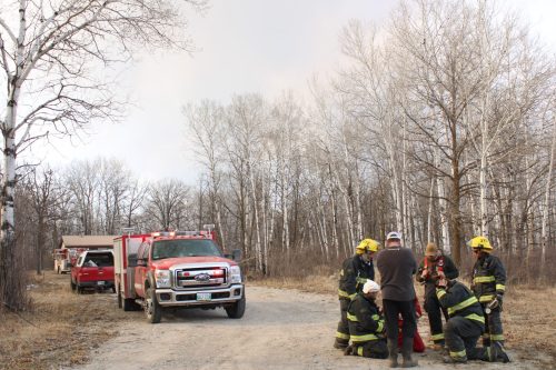 GREG VANDERMEULEN CARILLON ARCHVIVES 

Fire crews near Vita plan their attack on nearby wildfire in 2021. Municipal and Opposition leaders have raised concerns the 2026 provincial budget falls short in preparing Manitoba for the next wildfire season.