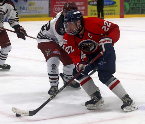 Dugald's Nolan van den Bussche carries the puck past a Pembina Valley defender during MMJHL action this season. Van den Bussche and the Transcona Railer Express swept their first and second round playoff series to advance to the league championships. (Cassidy Dankochik Carillon Archives)