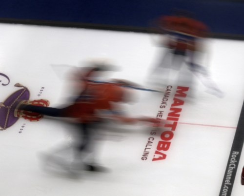 A player slides during the Grand Slam of Curling in Steinbach earlier this year. (Cassidy Dankochik Carillon Archives)