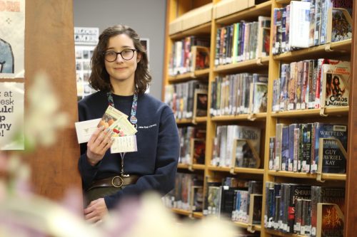 MATTHEW FRANK THE CARILLON 

Jill Snider, outreach and content coordinator for the Jake Epp Library, shows various seeds that will be available at the library’s free seed library. The resource will be available for use on April 20.