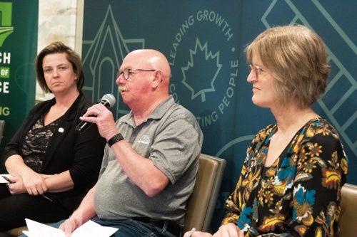 SVJETLANA MLINAREVIC THE CARILLON
Ken Dyck (South East Helping Hands) speaks during a panel discussion at the Steinbach Chamber of Commerce’s Collective Impact: Non-Profits at the Table at Smitty’s in Steinbach on May 14, 2026, while Steinbach Family Resource Centre’s executive director Jo-Anne Dalton and Jeannette DeLong (enVision Community Living listen. The chamber was asked by non-profits in the city to host an event where they could all meet and share their stories, what challenges they are encountering, and how they are building relationships in the community. Twenty-eight non-profits were represented at the luncheon.