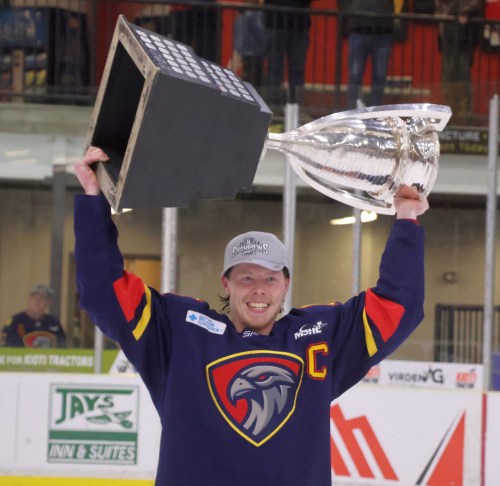 Adam Vigfusson hoists the Turnbull Cup following Niverville's sweep of the Virden Oil Capitals in the MJHL championship. (Cassidy Dankochik The Carillon)