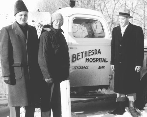 CARILLON ARCHIVES 

The Steinbach Kinsmen raised $3,000 to hook up Steinbach Bethesda Hospital to town sewer and water early in 1957. On hand to see the switch over were hospital administrator J. Klassen, Bethesda maintenance man A. D. Hiebert, and Steinbach Kinsmen president Hugh Atkinson. The familiar “honey wagon” was kept on standby, just in case of an emergency.