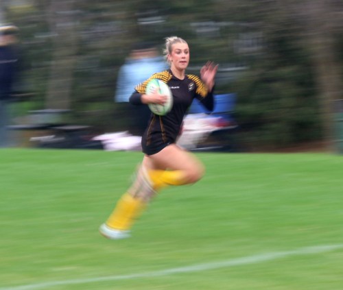 An SRSS player breaks free from the pack while on her way to a try. (Cassidy Dankochik The Carillon)