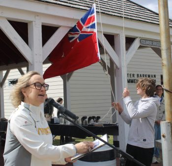 GREG VANDERMEULEN THE CARILLON 

Michelle Sawatzky-Koop sings the Manitoba Song as the provincial flag is raised on May 9.