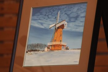 GREG VANDERMEULEN THE CARILLON 

A painting created by an artist who once called Steinbach home was donated to the Mennonite Heritage Village. In a ceremony coinciding with Manitoba Day, senior curator Garth Doerksen accepted the art piece from donors Gerry and Shirley Klassen. The painting, a winter scene of a windmill, was created by Juan Vicente Costales Artates, known in the Steinbach area as Vic Artates. Doerksen described him as a pioneer of sorts, as he was the first person born in the Philippines to call Steinbach home. He and his wife moved to Steinbach in 1967 where he became a lab technician at the Bethesda Hospital. He later moved into other work such as real estate and relocated to B.C. Artates, born in 1941, still lives in the Philippines.