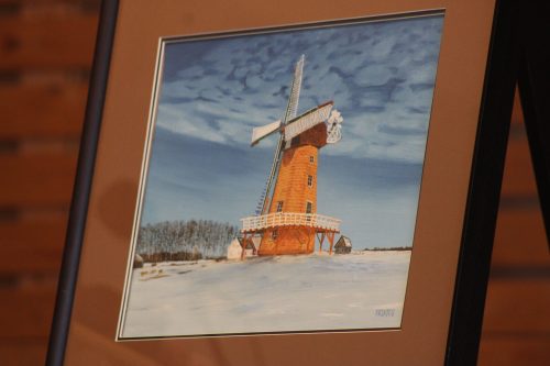 GREG VANDERMEULEN THE CARILLON 

A painting created by an artist who once called Steinbach home was donated to the Mennonite Heritage Village. In a ceremony coinciding with Manitoba Day, senior curator Garth Doerksen accepted the art piece from donors Gerry and Shirley Klassen. The painting, a winter scene of a windmill, was created by Juan Vicente Costales Artates, known in the Steinbach area as Vic Artates. Doerksen described him as a pioneer of sorts, as he was the first person born in the Philippines to call Steinbach home. He and his wife moved to Steinbach in 1967 where he became a lab technician at the Bethesda Hospital. He later moved into other work such as real estate and relocated to B.C. Artates, born in 1941, still lives in the Philippines.