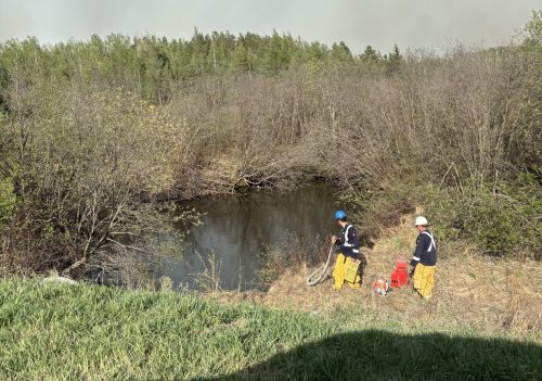 SUPPLIED 

Rural Municipality of Piney firefighters prepare to douse wildfires in the region in 2025. Local leaders are raising concerns that the persistent issue of poor cellular and internet coverage will put Piney residents at risk if there are more wildfires this year.