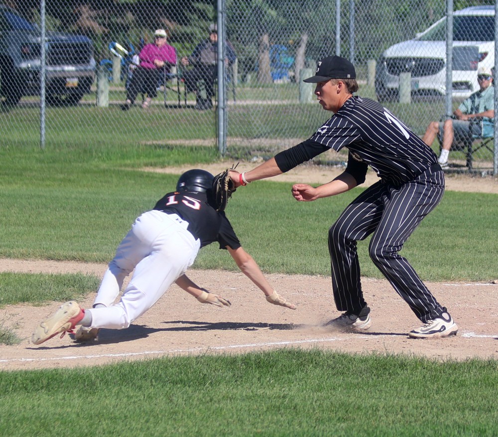 Ryan Powers may have pitched a combined scoreless six innings with nine strikeouts between both games of Carillon's double-header against Pembina Valley, but his most critical play may have been at home plate, tagging out a Orioles runner after an attempted suicide squeeze play. (Cassidy Dankochik The Carillon)