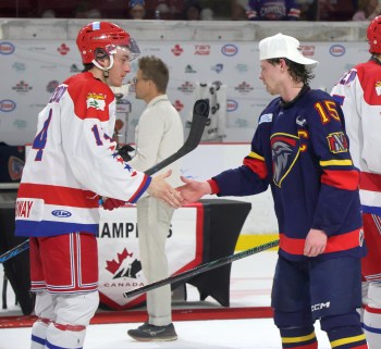 Adam Vigfusson shakes hands with Summerside Western Capitals players after his Niverville team won the Centennial Cup. (Cassidy Dankochik The Carillon)