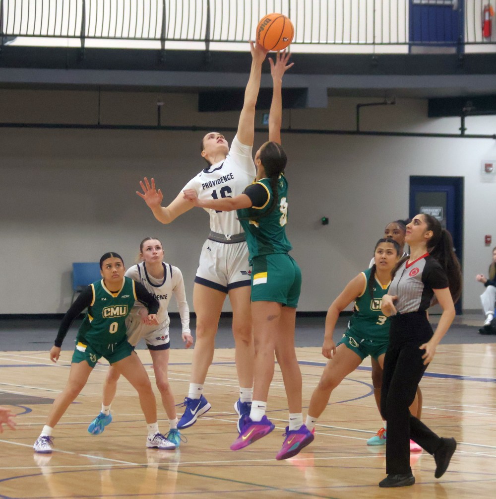 Faith Larocque jousts for the ball during a tip-off at a Manitoba Colleges Athletic Association game. The Niverville-born power forward played her high school ball in Dakota, but got to play a couple seasons in her hometown with Providence College. (Cassidy Dankochik Carillon Archives)