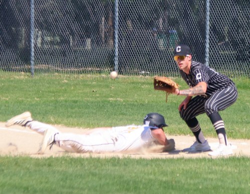 Cody Gunderson holds a runner at first during his second game back with the Carillon Sultans. (Cassidy Dankochik The Carillon)