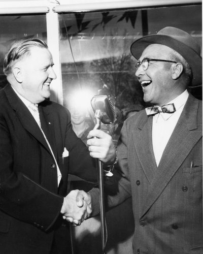 CARILLON ARCHIVES 

A.D. Penner congratulates Isaac Giesbrecht for winning the 1959 Dodge Crusader, which was the top prize at the annual Penner’s Give-Away Day in June of 1959. For years the popular Penner promotion drew hundreds of people each year for free coffee and donuts, entertaining skits and the chance to win one of three dozen door prizes.