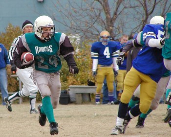 Craig Toews runs back a kick-off for the Eastman Raiders in a 23-20 upset of the Fort Gary Lions to earn a berth in the league finals against the Winnipeg Nomads.