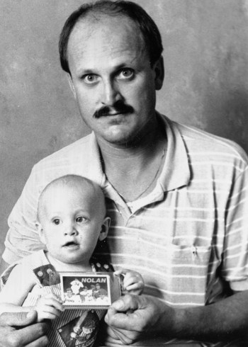 One-year-old Barret Rott gets his baseball card collection launched in a big way as his father, Ralph, is one of a lucky 2,500 to find an autographed Nolan Ryan card in a $1.50 packet of cards in the 1991 Upper Deck Baseball series. Darel Lepp, manager of Collectors’ Choice in Steinbach, says the card is extremely rare and is valued at around $1,000. Rott purchased the $1.50 packet of cards for a collection he was starting for his son.