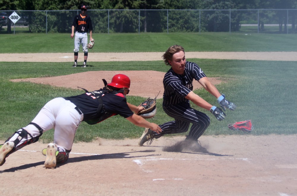 Mason Hooper eludes a tag while scoring a run during MJBL action at A.D. Penner Park June 14. (Cassidy Dankochik The Carillon)