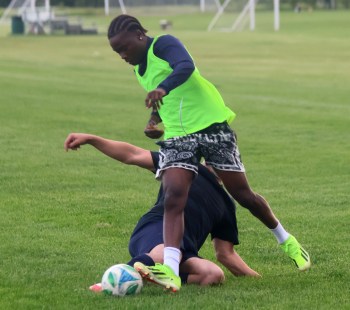 A Hanover Soccer player darts by a teammate during a scrimmage June 11. A scheduled game against Stonewall had to be postponed due to flooding in the Interlake town. (Cassidy Dankochik The Carillon)