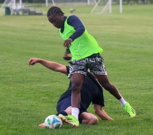 A Hanover Soccer player darts by a teammate during a scrimmage June 11. A scheduled game against Stonewall had to be postponed due to flooding in the Interlake town. (Cassidy Dankochik The Carillon)