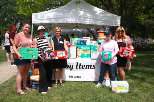 SUPPLIED
The Life Culture staff stands in front of the diapoer donation booth.